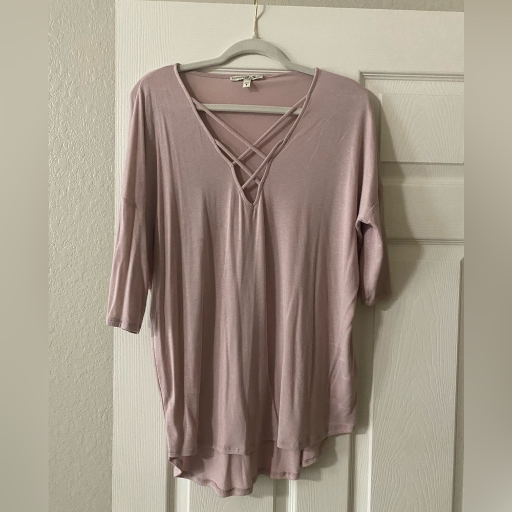 Mauve colored, three-quarter sleeve with crisscross accent